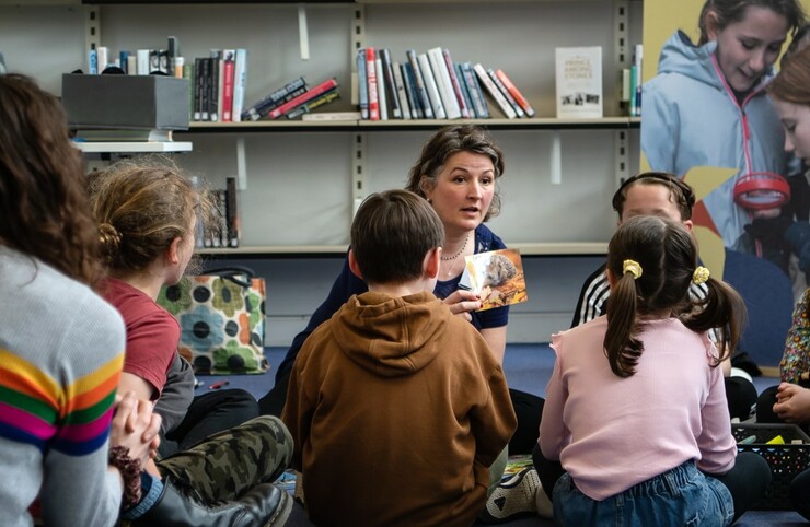 Kay McCrann talking to children