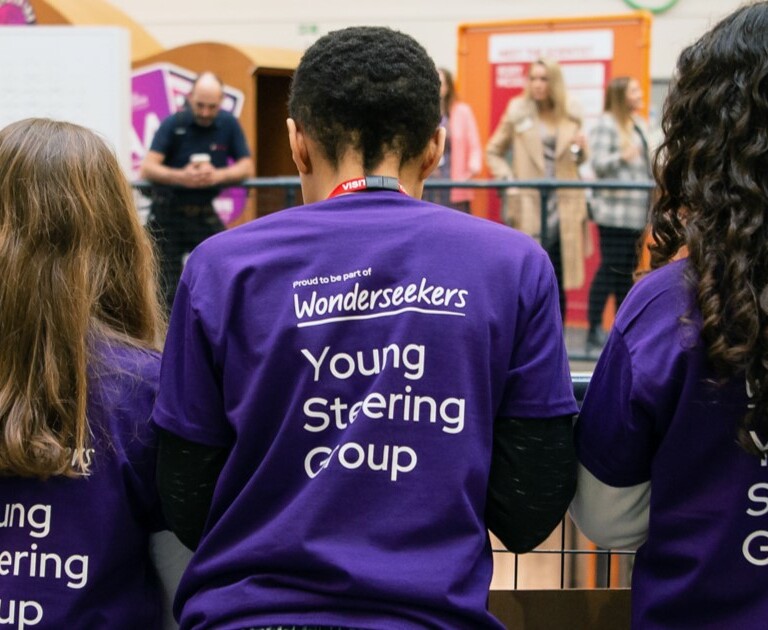 Children in the Young Steering Group wearing purple Wonderseekers t-shirts