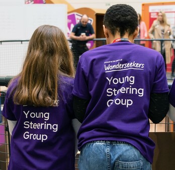 Children in the Young Steering Group wearing purple Wonderseekers t-shirts
